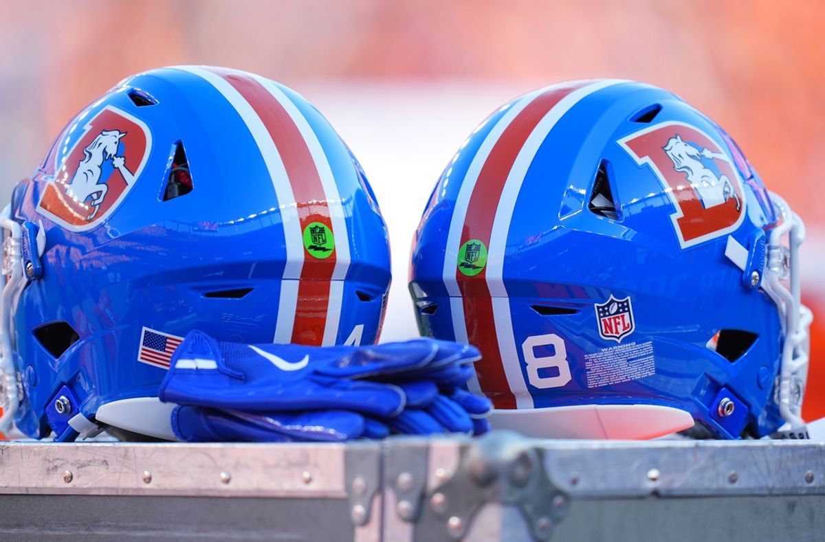 Oct 6, 2024; Denver, Colorado, USA; Detailed view of the throw back helmets worn by the Denver Broncos during the game against the Las Vegas Raiders at Empower Field at Mile High. Mandatory Credit: Ron Chenoy-Imagn Images