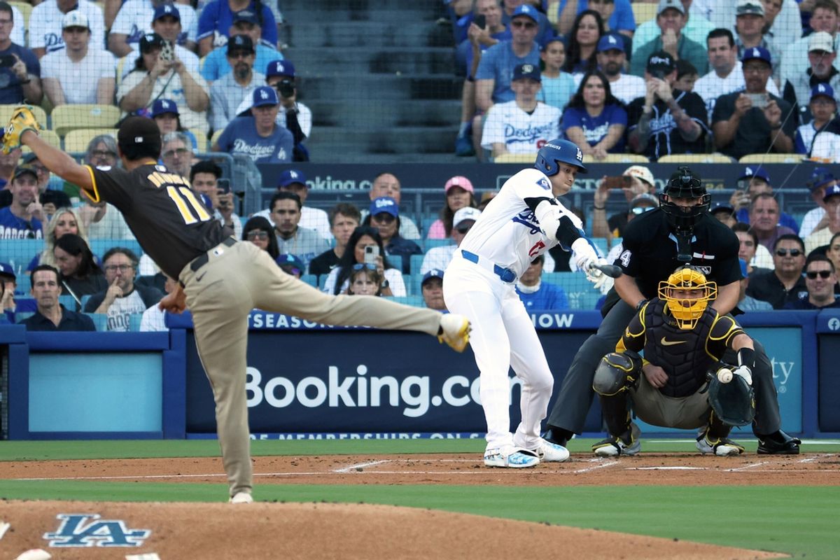Oct 6, 2024; Los Angeles, California, USA; Los Angeles Dodgers designated hitter Shohei Ohtani (17) strikes out against San Diego Padres pitcher Yu Darvish (11) in the first inning during game two of the NLDS for the 2024 MLB Playoffs at Dodger Stadium. Mandatory Credit: Kiyoshi Mio-Imagn Images