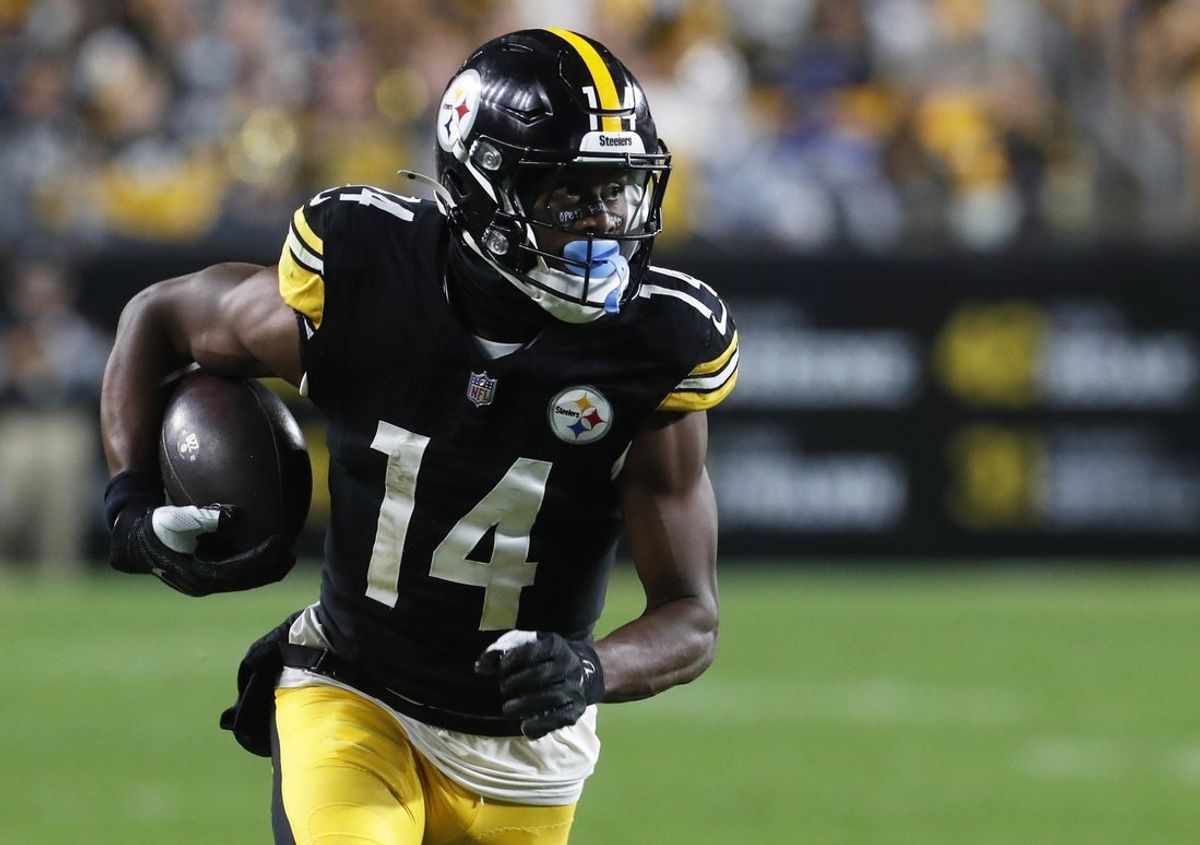 Oct 6, 2024; Pittsburgh, Pennsylvania, USA;  Pittsburgh Steelers wide receiver George Pickens (14) runs after a catch against the Dallas Cowboys during the fourth quarter at Acrisure Stadium. Dallas won 20-17. Mandatory Credit: Charles LeClaire-Imagn Images