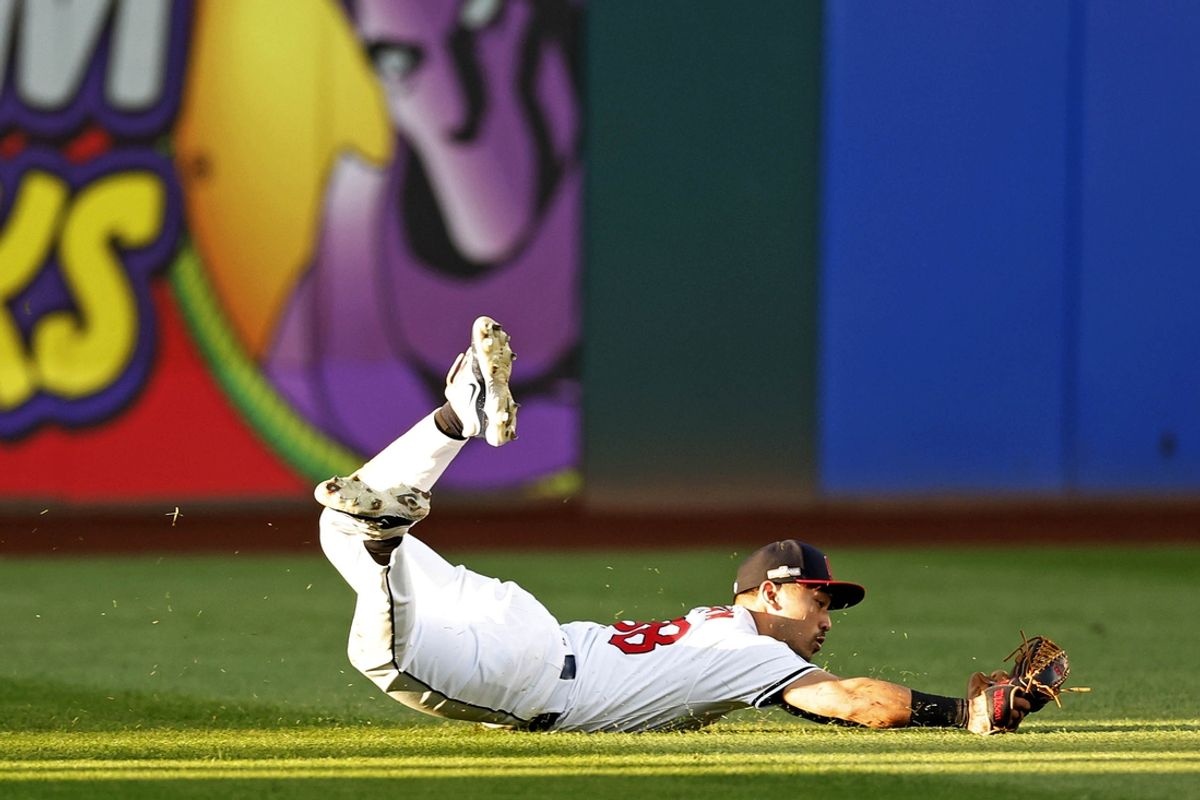 Oct 7, 2024; Cleveland, Ohio, USA; Cleveland Guardians outfielder Steven Kwan (38) dives to make a catch during the eighth inning against the Detroit Tigers during game two of the ALDS for the 2024 MLB Playoffs at Progressive Field. Mandatory Credit: Scott Galvin-Imagn Images