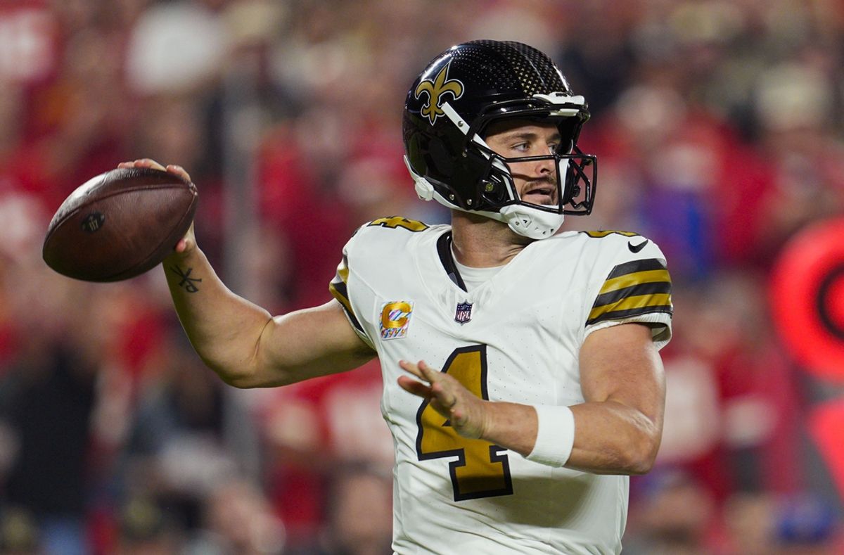 Oct 7, 2024; Kansas City, Missouri, USA; New Orleans Saints quarterback Derek Carr (4) throws a pass during the first half against the Kansas City Chiefs at GEHA Field at Arrowhead Stadium. Mandatory Credit: Jay Biggerstaff-Imagn Images