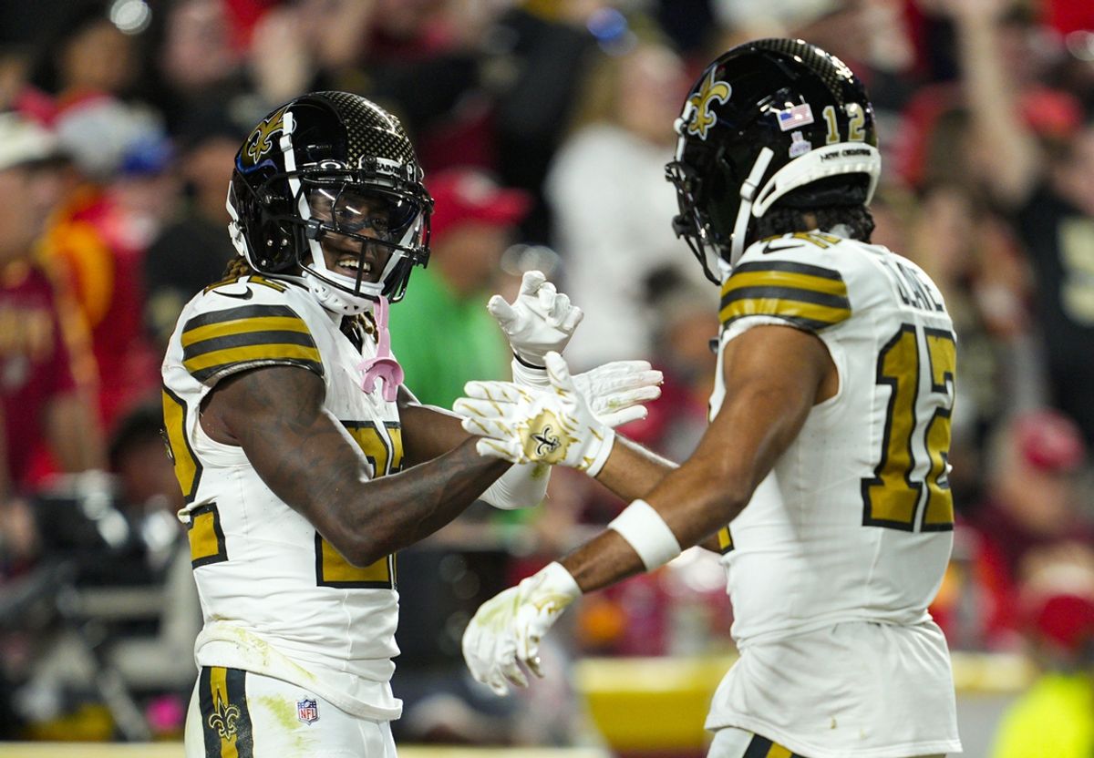 Oct 7, 2024; Kansas City, Missouri, USA; New Orleans Saints wide receiver Rashid Shaheed (22) celebrates with wide receiver Chris Olave (12) after scoring a touchdown during the first half against the Kansas City Chiefs at GEHA Field at Arrowhead Stadium. Mandatory Credit: Jay Biggerstaff-Imagn Images
