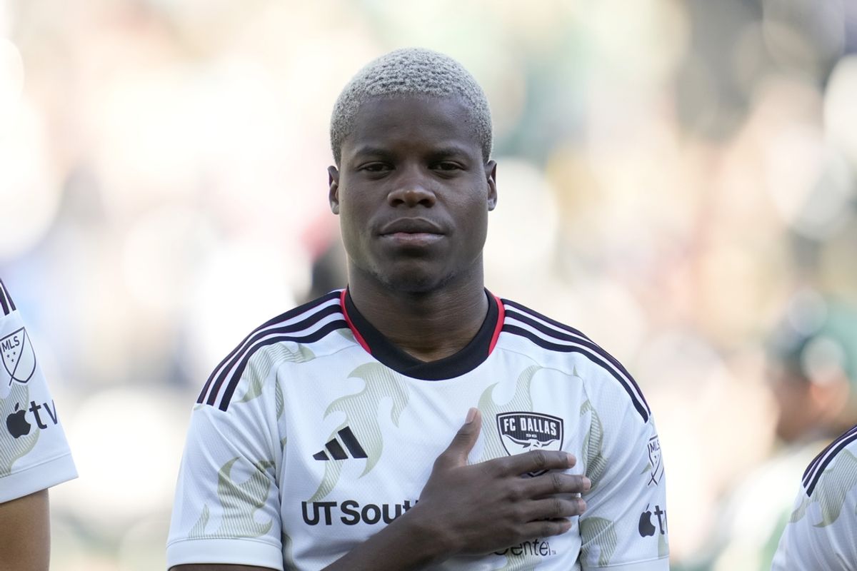 Oct 6, 2024; Portland, Oregon, USA; FC Dallas forward Bernard Kamungo (77) stands during the singing of the National Anthem before a game against the Portland Timbers at Providence Park. Mandatory Credit: Soobum Im-Imagn Images