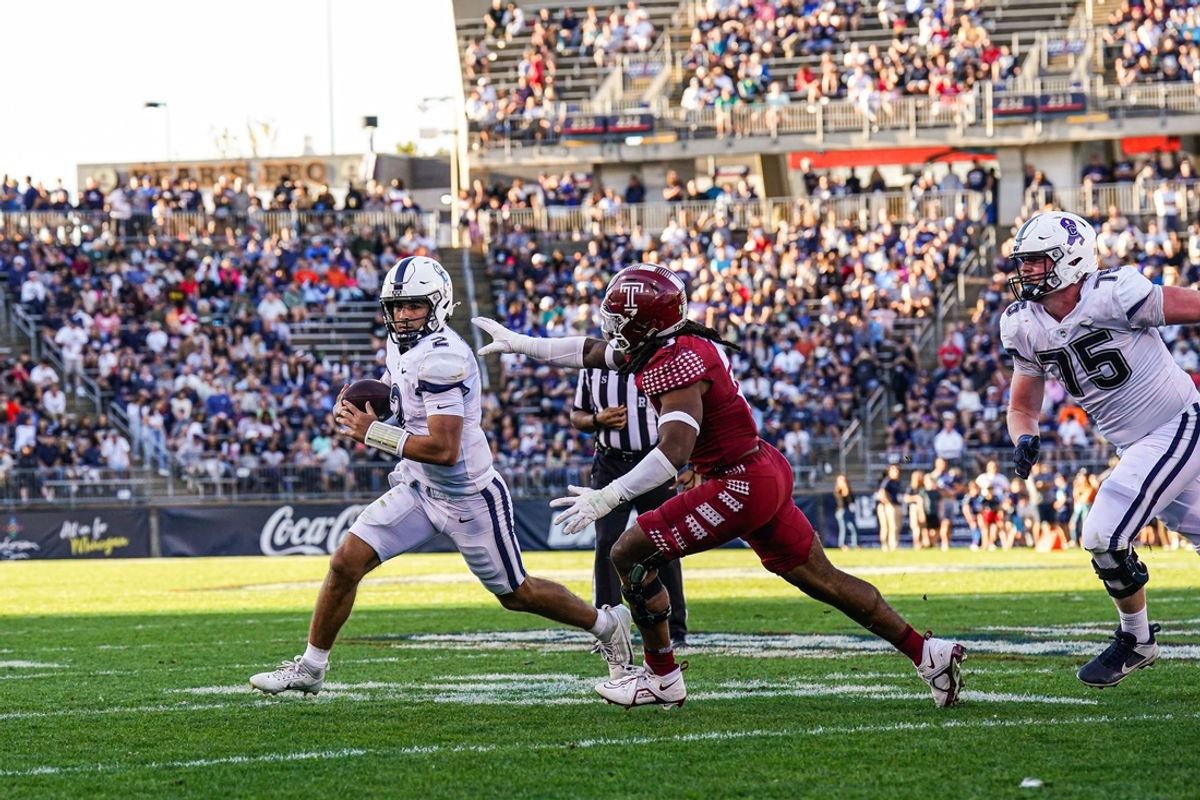 Oct 5, 2024; East Hartford, Connecticut, USA;  Connecticut Huskies quarterback Joe Fagnano (2) runs the ball against the Temple Owls in the second quarter at Rentschler Field at Pratt & Whitney Stadium. Mandatory Credit: David Butler II-Imagn Images