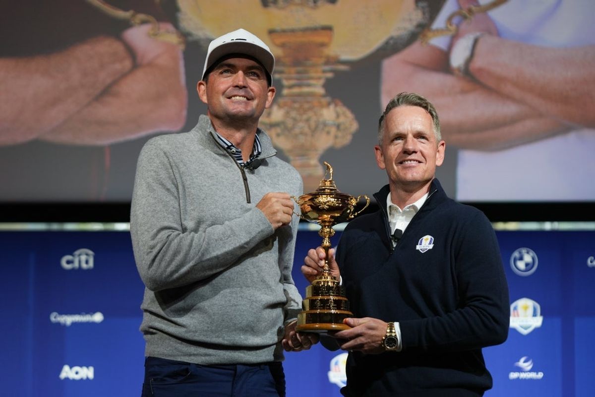 Oct 8, 2024; New York, New York, USA; US team captain Keegan Bradley, left, and Europe team captain Luke Donald take a photo with the Ryder Cup after a press conference at Times Center. Mandatory Credit: Lucas Boland-Imagn Images