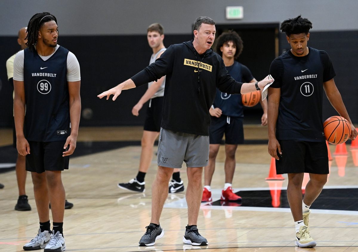 Vanderbilt head coach Mark Byington instructs forward Devin McGlockton (99) and guard A.J. Hoggard (11) during an NCAA college basketball practice Tuesday, October 8, 2024, in Nashville, Tenn.