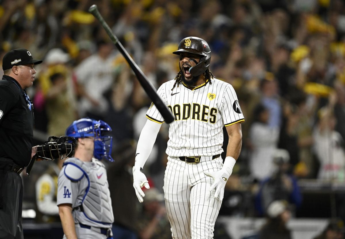 Oct 8, 2024; San Diego, California, USA; San Diego Padres outfielder Fernando Tatis Jr. (23) reacts after hitting a home run in the second inning against the Los Angeles Dodgers during game three of the NLDS for the 2024 MLB Playoffs at Petco Park.  Mandatory Credit: Denis Poroy-Imagn Images