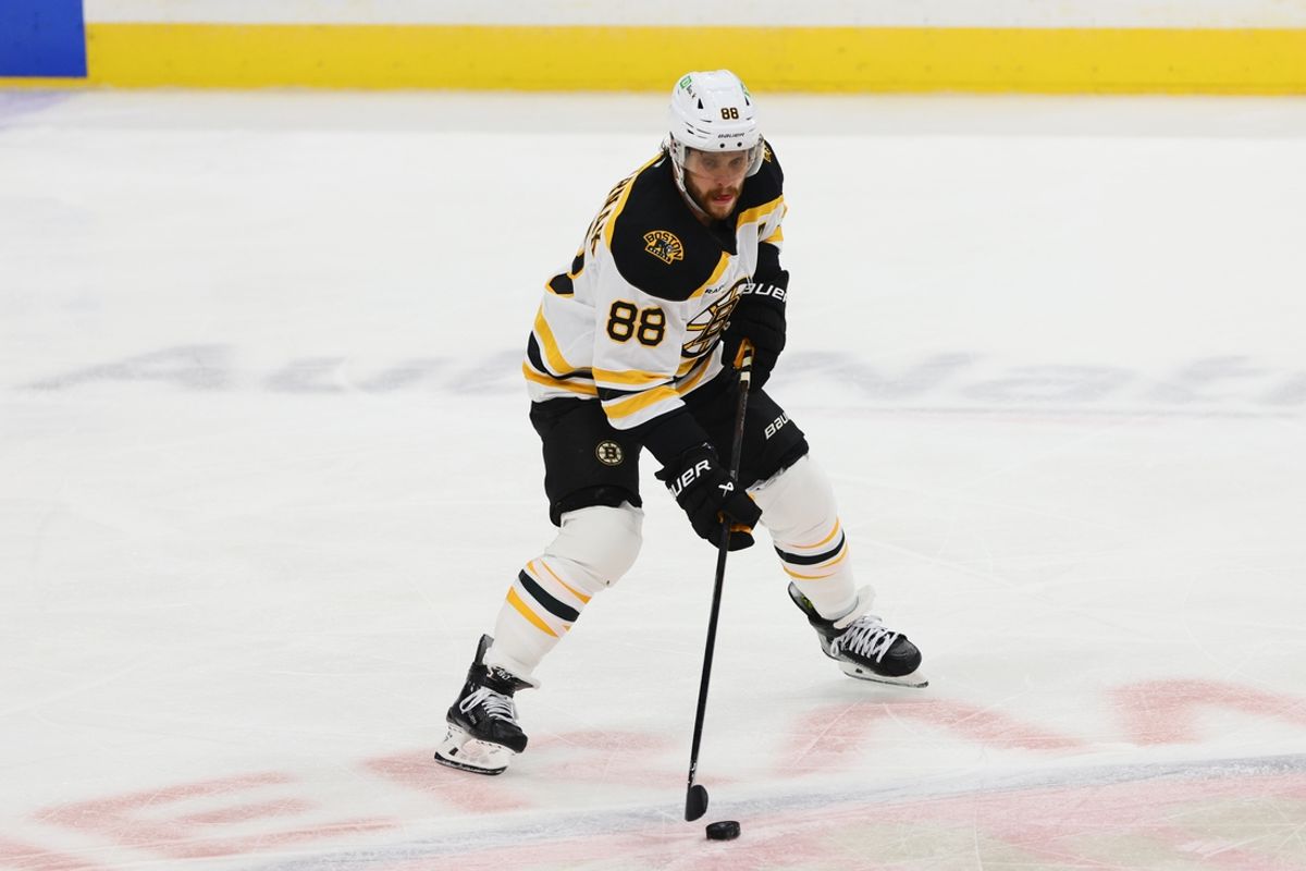 Oct 8, 2024; Sunrise, Florida, USA; Boston Bruins right wing David Pastrnak (88) moves the puck against the Florida Panthers during the third period at Amerant Bank Arena. Mandatory Credit: Sam Navarro-Imagn Images