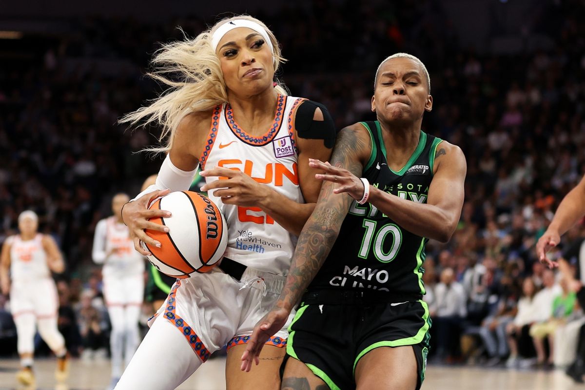 Oct 8, 2024; Minneapolis, Minnesota, USA; Connecticut Sun guard DiJonai Carrington (21) works toward the basket as Minnesota Lynx guard Courtney Williams (10) defends during the second half of game five of the 2024 WNBA playoffs at Target Center. Mandatory Credit: Matt Krohn-Imagn Images