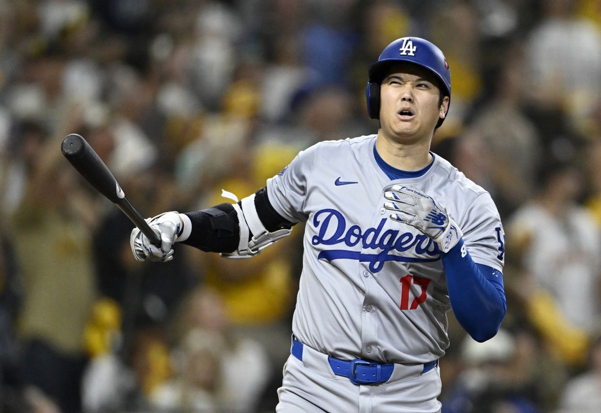 Oct 8, 2024; San Diego, California, USA; Los Angeles Dodgers designated hitter Shohei Ohtani (17) reacts to a strike in the eighth inning against the San Diego Padres during game three of the NLDS for the 2024 MLB Playoffs at Petco Park.  Mandatory Credit: Denis Poroy-Imagn Images