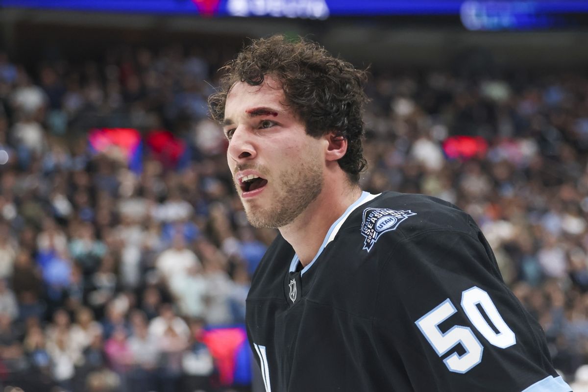 Oct 8, 2024; Salt Lake City, Utah, USA; Utah Hockey Club defenseman Sean Durzi (50) reacts to a penally for fighting against the Chicago Blackhawks and a cut on the eyebrow during the second period at Delta Center. Mandatory Credit: Rob Gray-Imagn Images