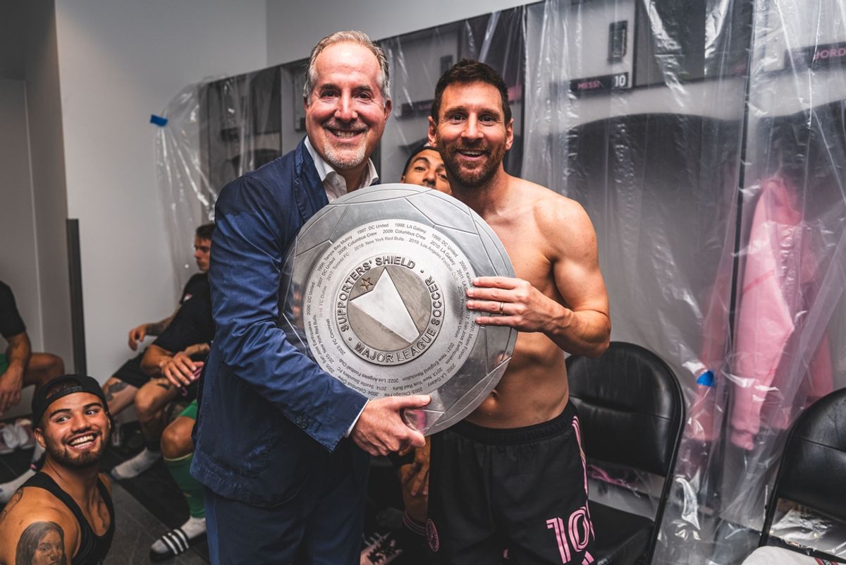 Oct 2, 2024; Columbus, Ohio, USA; Inter Miami CF majority owner Jorge Mas and forward Lionel Messi (10) celebrate with the Supporters’ Shield in the locker room after defeating the Columbus Crew at Lower.com Field. Mandatory Credit: Inter Miami CF/MLS Photos via Imagn Images