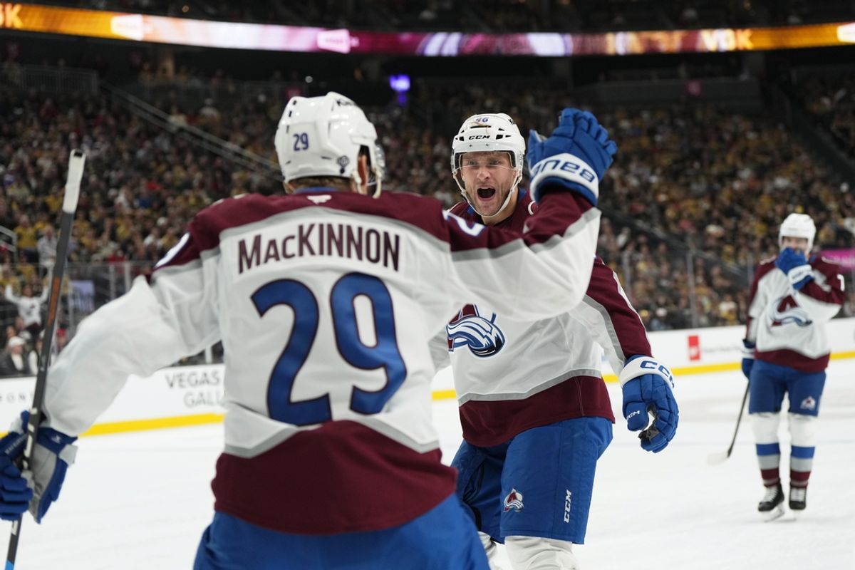 Oct 9, 2024; Las Vegas, Nevada, USA; Colorado Avalanche right wing Mikko Rantanen (96) celebrates with center Nathan MacKinnon (29) after scoring a goal against the Vegas Golden Knights during the first period at T-Mobile Arena. Mandatory Credit: Lucas Peltier-Imagn Images