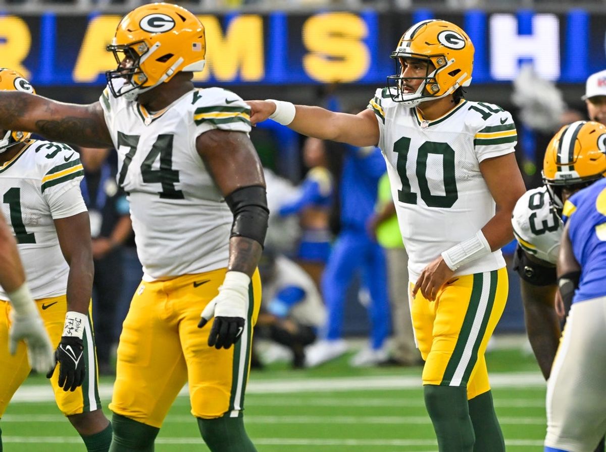 Oct 6, 2024; Inglewood, California, USA; Green Bay Packers guard Elgton Jenkins (74) and Green Bay Packers quarterback Jordan Love (10) during the third quarter against the Los Angeles Rams at SoFi Stadium. Mandatory Credit: Robert Hanashiro-Imagn Images