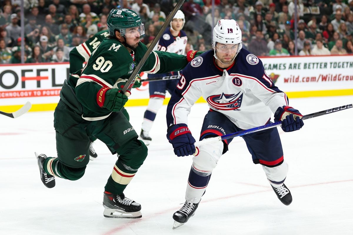 Oct 10, 2024; Saint Paul, Minnesota, USA; Minnesota Wild center Marcus Johansson (90) and Columbus Blue Jackets center Adam Fantilli (19) compete for the puck during the second period at Xcel Energy Center. Mandatory Credit: Matt Krohn-Imagn Images