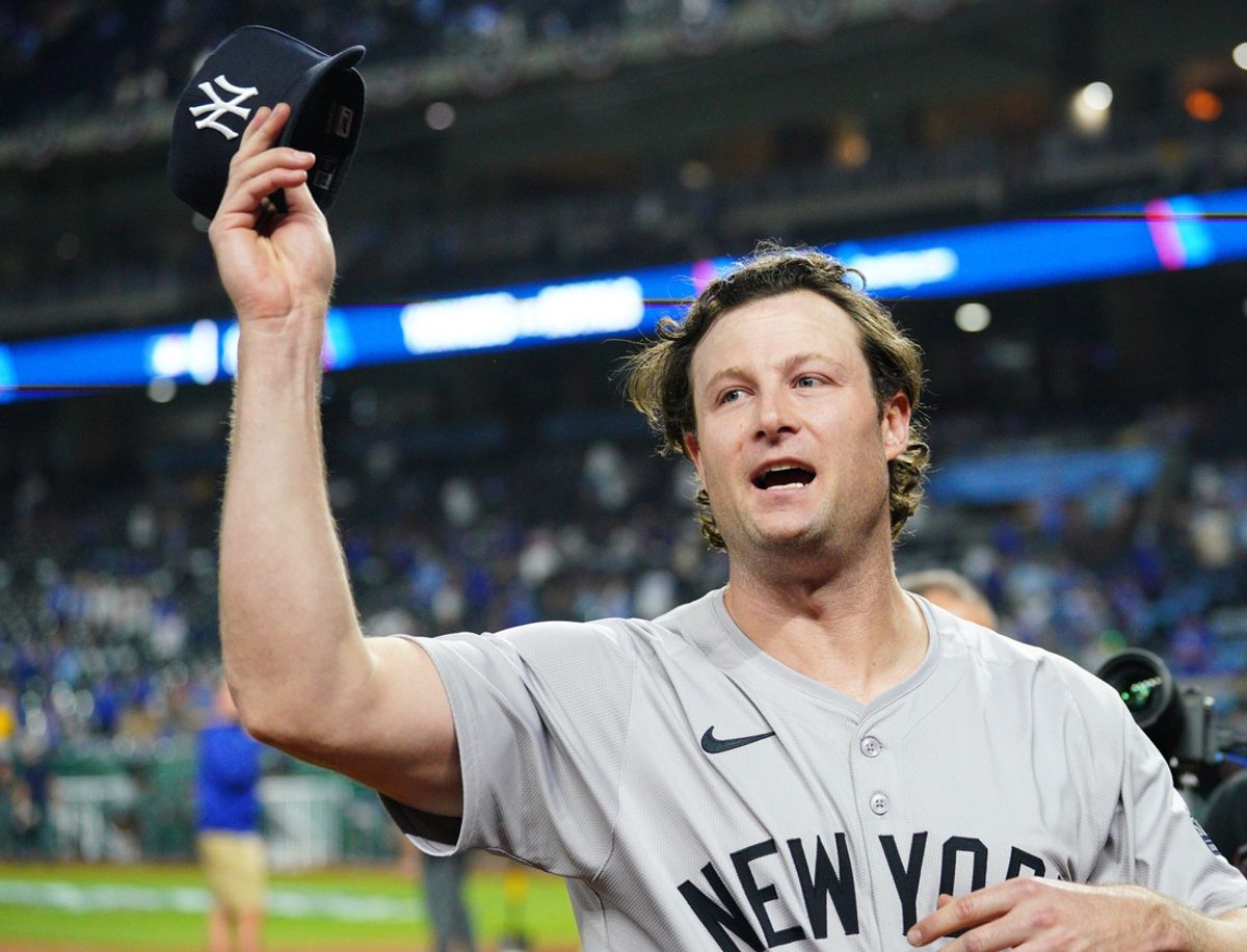 Oct 10, 2024; Kansas City, Missouri, USA; New York Yankees pitcher Gerrit Cole (45) waves to fans following a win over the Kansas City Royals during game four of the ALDS for the 2024 MLB Playoffs at Kauffman Stadium. Mandatory Credit: Denny Medley-Imagn Images