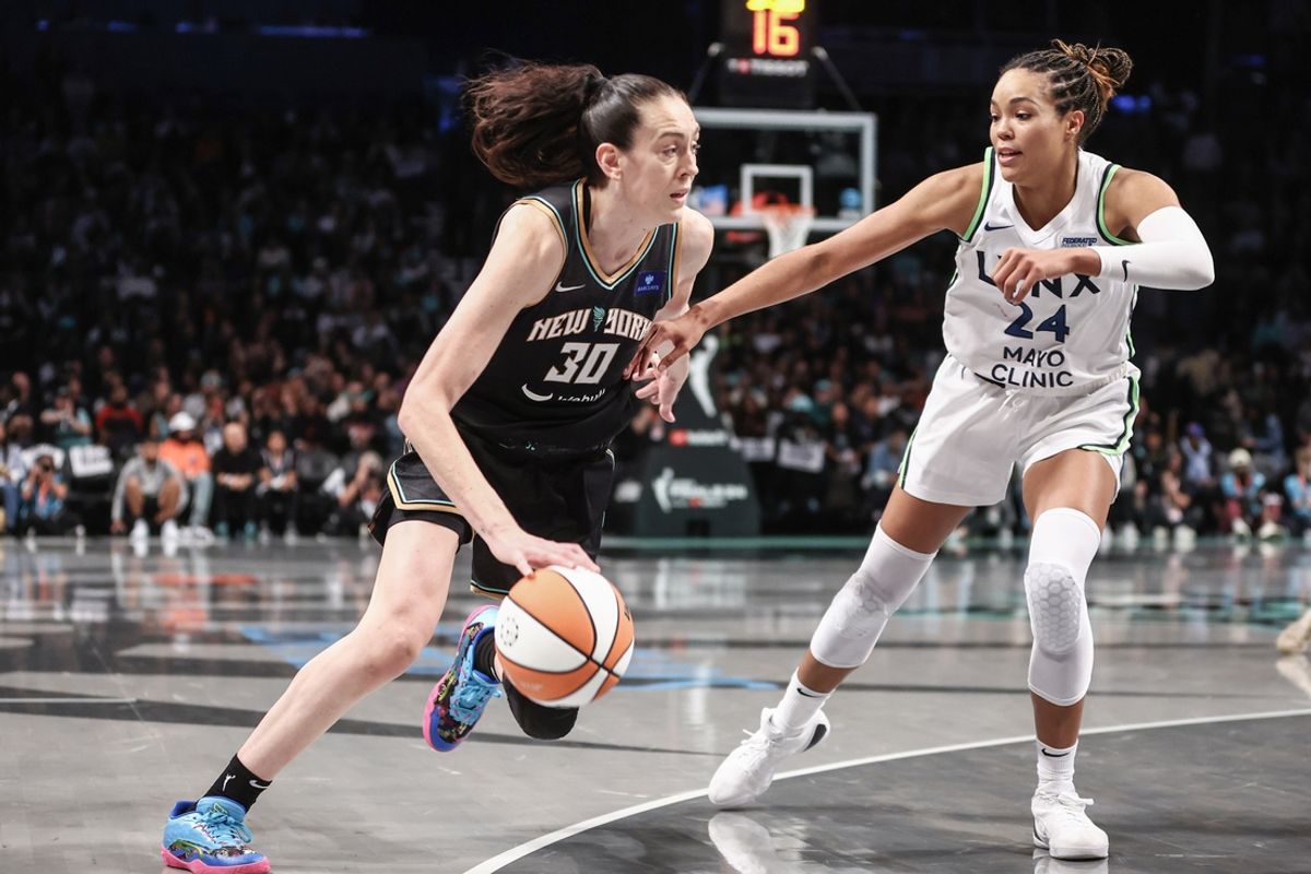 Oct 10, 2024; Brooklyn, New York, USA; New York Liberty forward Breanna Stewart (30) dribbles the ball as Minnesota Lynx forward Napheesa Collier (24) defends in the third quarter at Barclays Center. Mandatory Credit: Wendell Cruz-Imagn Images