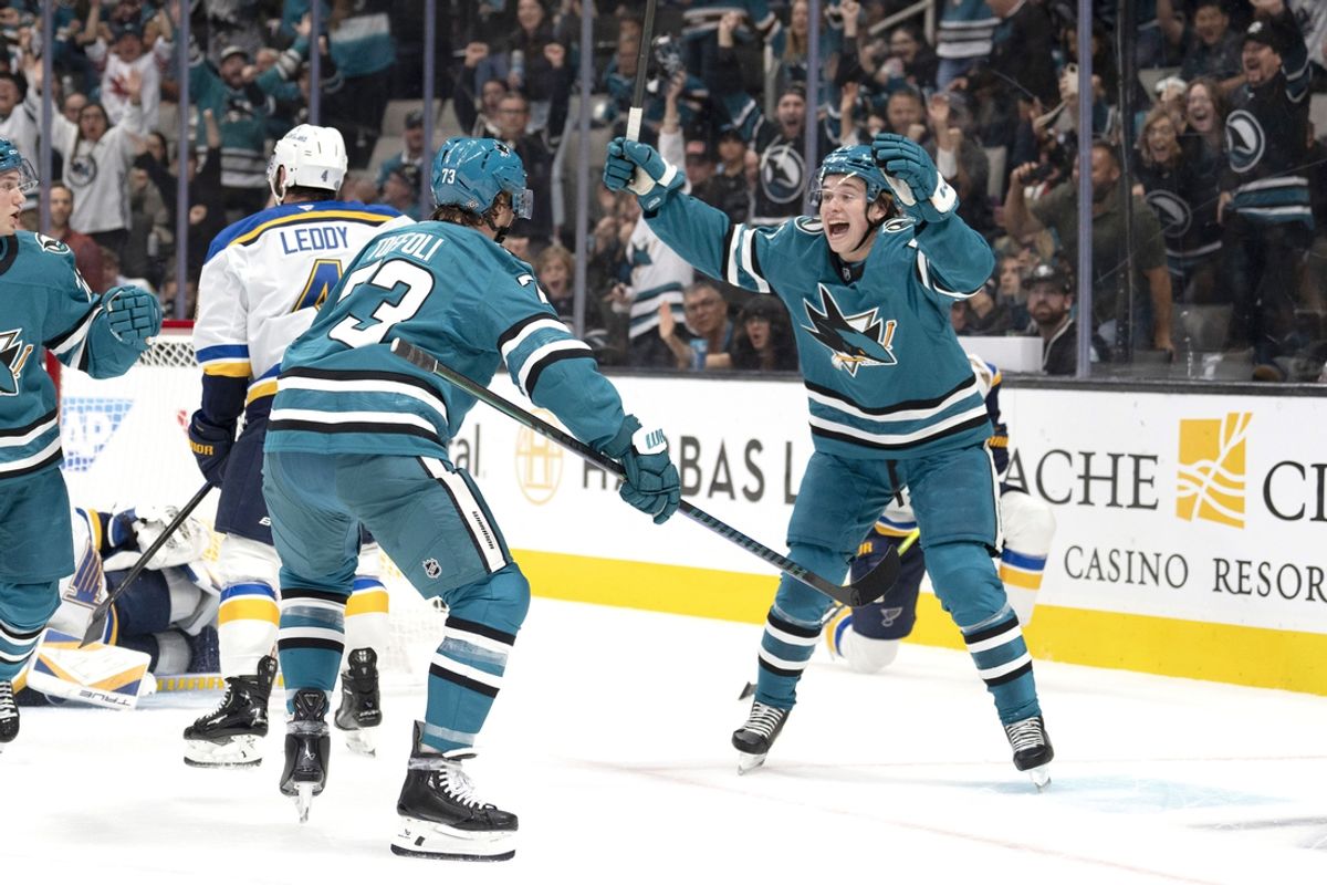 Oct 10, 2024; San Jose, California, USA; San Jose Sharks center Macklin Celebrini (71) reacts after center Tyler Toffoli (73) scores a goal during the first period against the St. Louis Blues at SAP Center at San Jose. Mandatory Credit: Stan Szeto-Imagn Images
