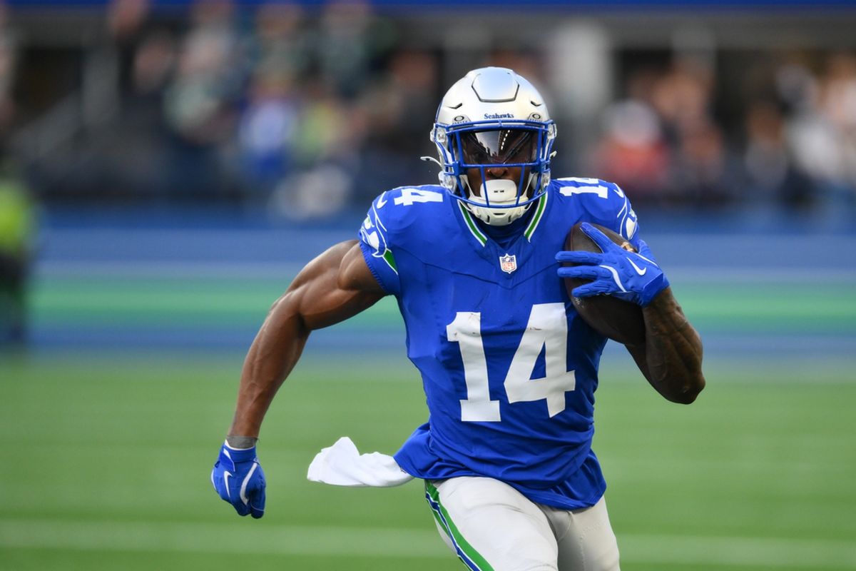 Oct 10, 2024; Seattle, Washington, USA; Seattle Seahawks wide receiver DK Metcalf (14) carries the ball after a catch during the first half against the San Francisco 49ers at Lumen Field. Mandatory Credit: Steven Bisig-Imagn Images