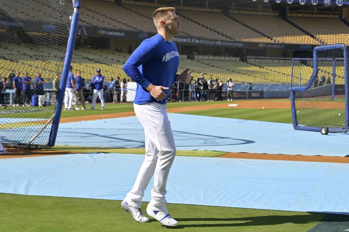 Oct 11, 2024; Los Angeles, California, USA; Los Angeles Dodgers first baseman Freddie Freeman (5) warms up before game five against the San Diego Padres in the NLDS for the 2024 MLB Playoffs at Dodger Stadium. Mandatory Credit: Jayne Kamin-Oncea-Imagn Images