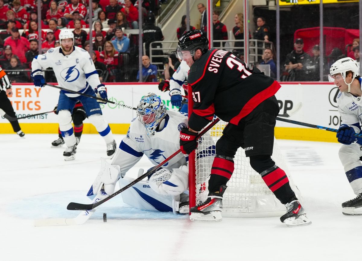 Oct 11, 2024; Raleigh, North Carolina, USA;  Tampa Bay Lightning goaltender Andrei Vasilevskiy (88) stops the shot attempt by Carolina Hurricanes right wing Andrei Svechnikov (37) during the first period at PNC Arena. Mandatory Credit: James Guillory-Imagn Images