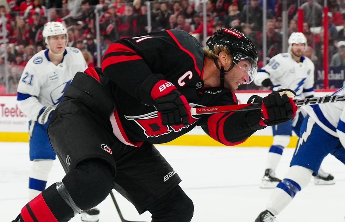 Oct 11, 2024; Raleigh, North Carolina, USA;  Carolina Hurricanes center Jordan Staal (11) takes a shot against the Tampa Bay Lightning during the first period at PNC Arena. Mandatory Credit: James Guillory-Imagn Images