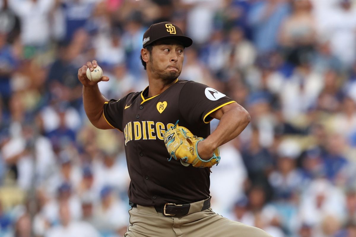 Oct 11, 2024; Los Angeles, California, USA; San Diego Padres pitcher Yu Darvish (11) pitches against the Los Angeles Dodgers in the first inning during game five of the NLDS for the 2024 MLB Playoffs at Dodger Stadium. Mandatory Credit: Kiyoshi Mio-Imagn Images