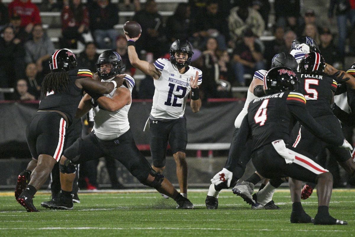 Oct 11, 2024; College Park, Maryland, USA;  Northwestern Wildcats quarterback Jack Lausch (12) throws from the pocket during the first half against the Maryland Terrapins at SECU Stadium. Mandatory Credit: Tommy Gilligan-Imagn Images