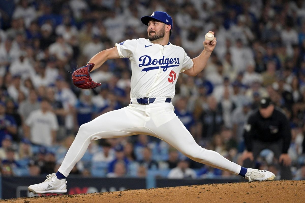 Oct 11, 2024; Los Angeles, California, USA; Los Angeles Dodgers pitcher Alex Vesia (51) pitches in the seventh inning  against the San Diego Padres during game five of the NLDS for the 2024 MLB Playoffs at Dodger Stadium. Mandatory Credit: Jayne Kamin-Oncea-Imagn Images