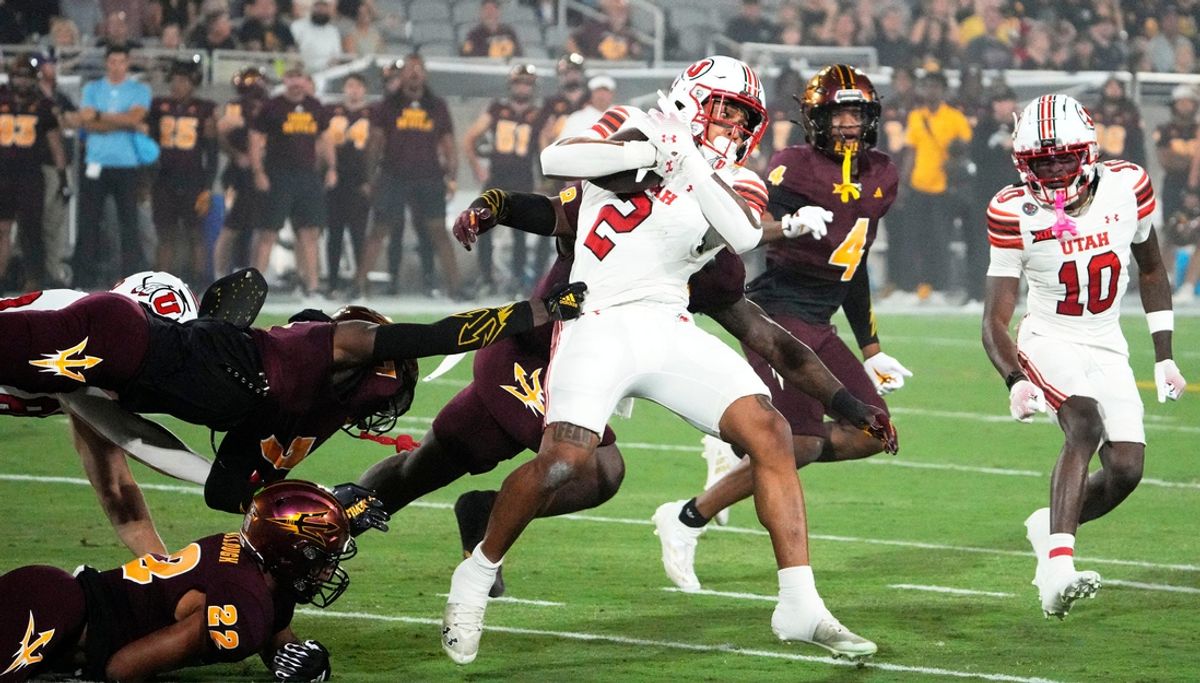 Utah Utes running back Micah Bernard (2) is tackled by the Arizona State Sun Devils in the first half at Mountain America Stadium in Tempe on Oct. 11, 2024.
