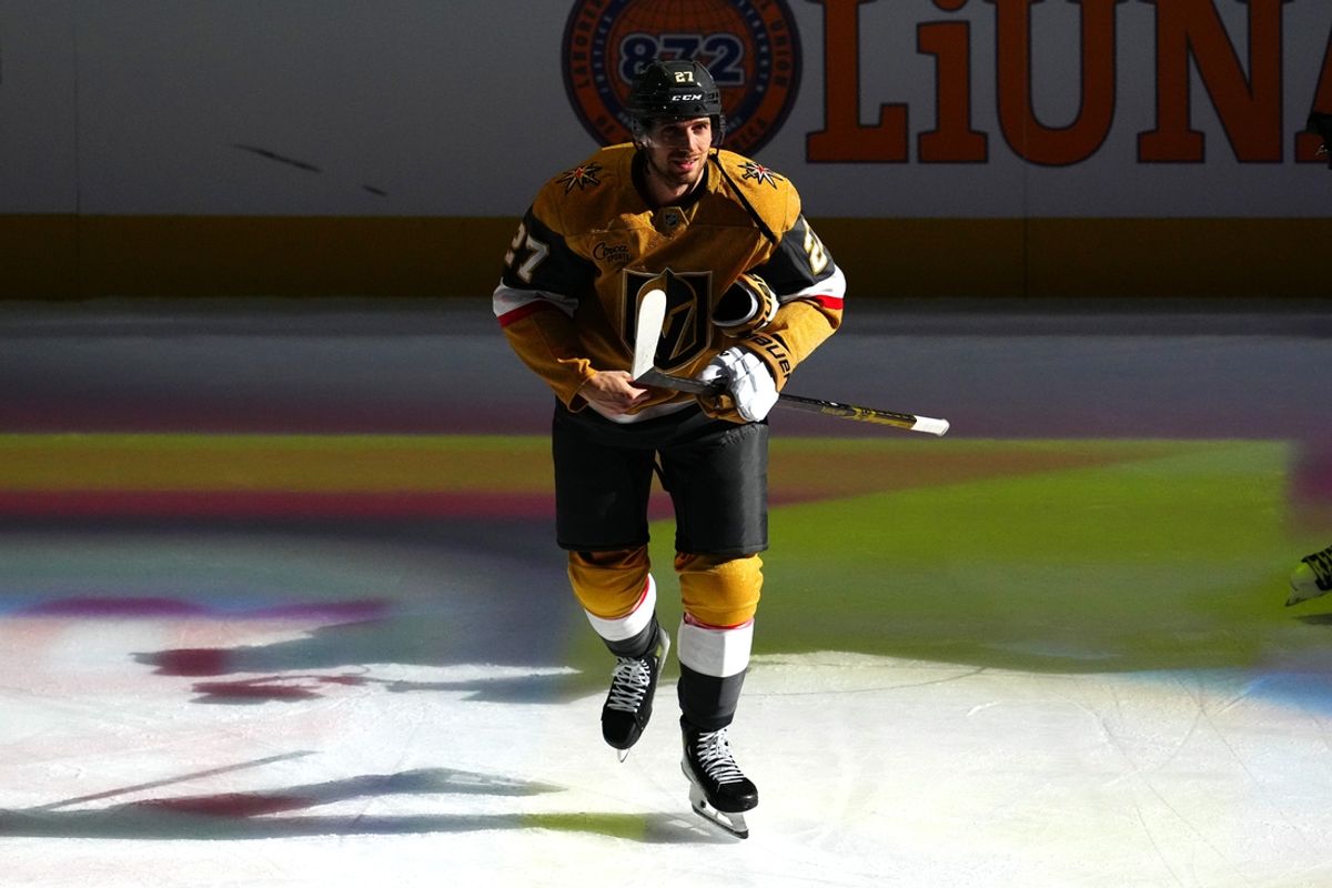Oct 11, 2024; Las Vegas, Nevada, USA; Vegas Golden Knights defenseman Shea Theodore (27) is named First Star of the Game after the Golden Knights defeated the St. Louis Blues 4-3 at T-Mobile Arena. Mandatory Credit: Stephen R. Sylvanie-Imagn Images