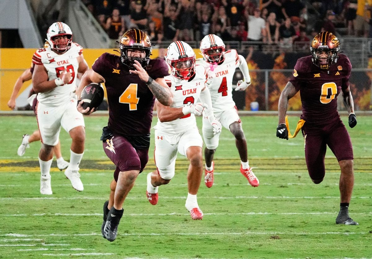 Arizona State Sun Devils running back Cam Skattebo (4) runs for a touchdown against the Utah Utes in the fourth quarter at Mountain America Stadium.