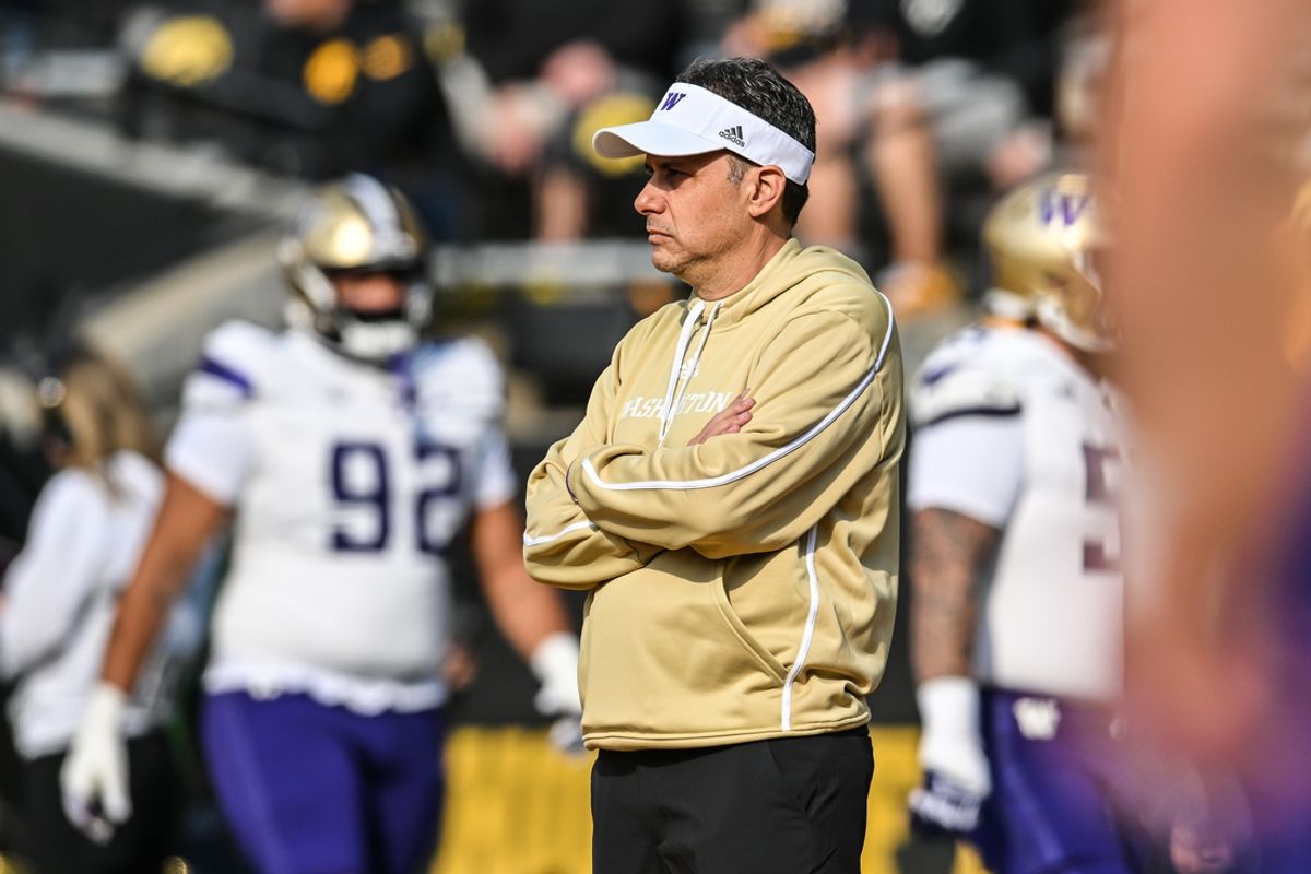 Oct 12, 2024; Iowa City, Iowa, USA; Washington Huskies head coach Jedd Fisch watches his team warm up before the game against the Iowa Hawkeyes at Kinnick Stadium. Mandatory Credit: Jeffrey Becker-Imagn Images