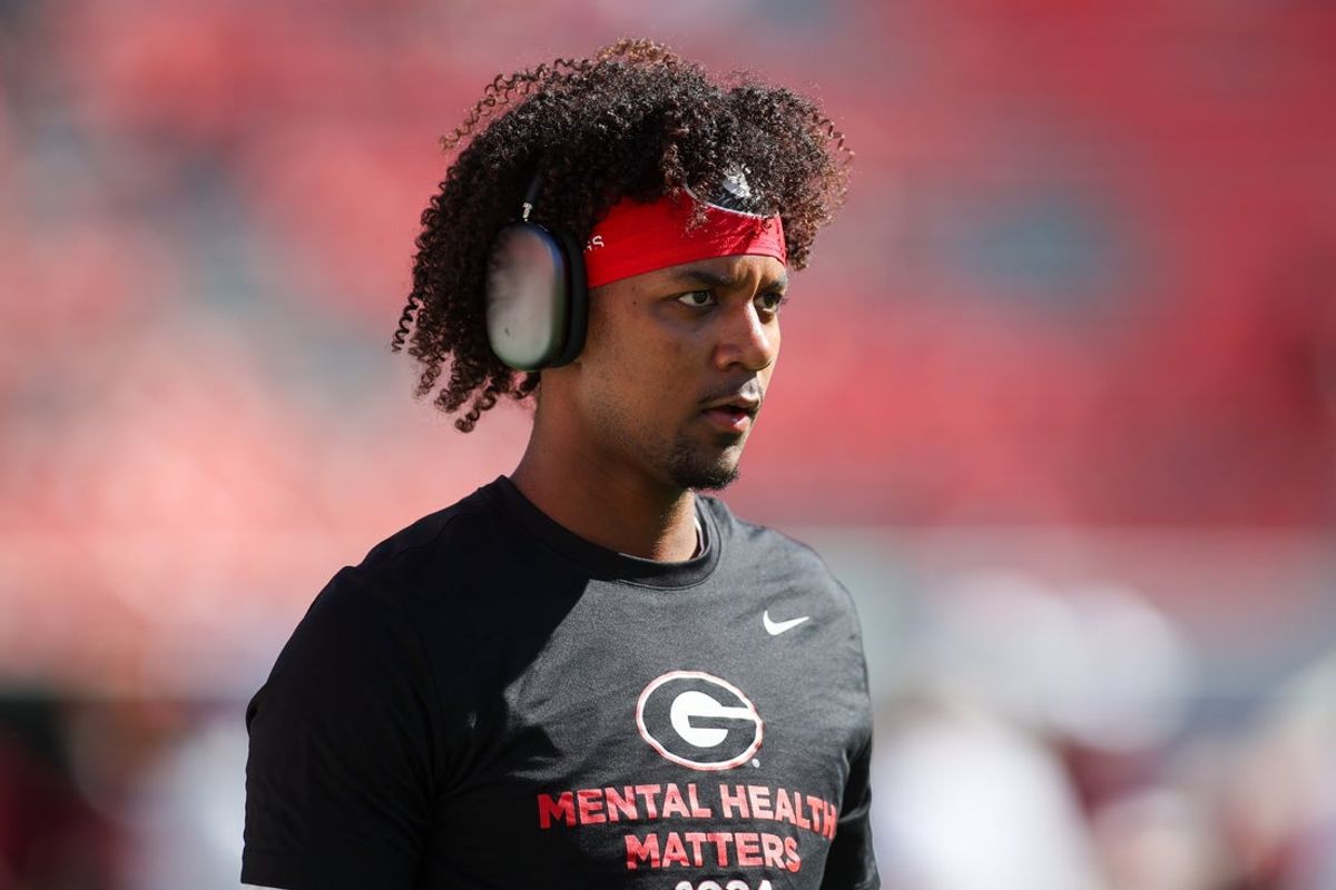 Oct 12, 2024; Athens, Georgia, USA; Georgia Bulldogs quarterback Jaden Rashada (10) warms up before a game against the Mississippi State Bulldogs at Sanford Stadium. Mandatory Credit: Brett Davis-Imagn Images