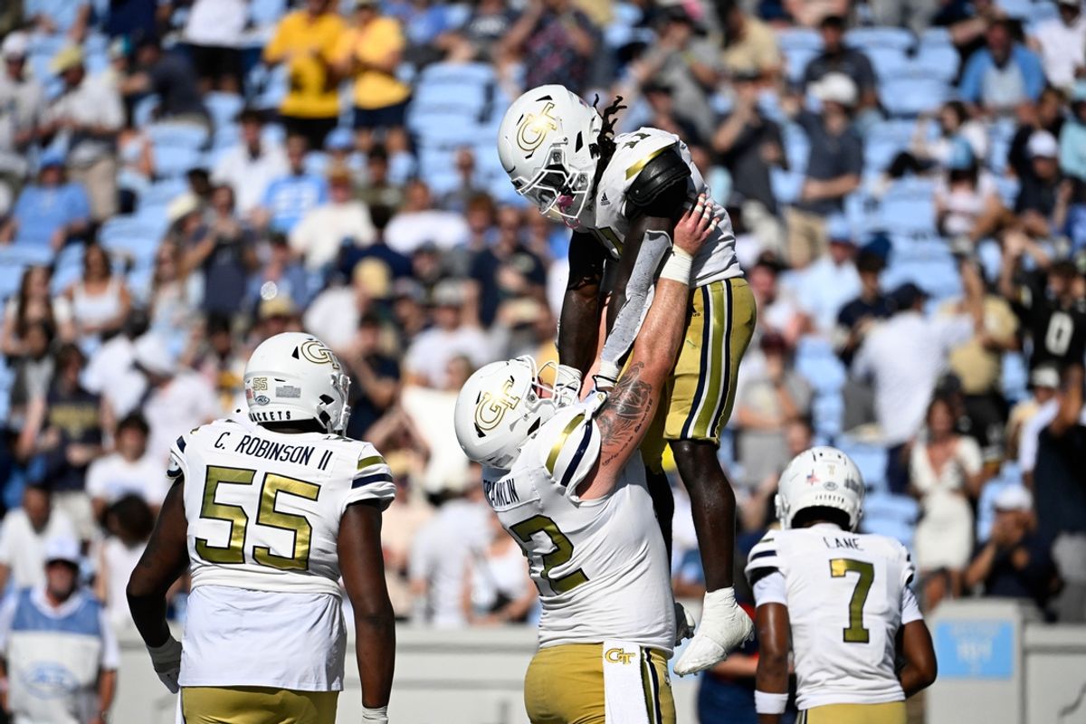 Oct 12, 2024; Chapel Hill, North Carolina, USA; Georgia Tech Yellow Jackets running back Jamal Haynes (11) is hoisted in the air after scoring a touchdown in the fourth quarter at Kenan Memorial Stadium. Mandatory Credit: Bob Donnan-Imagn Images