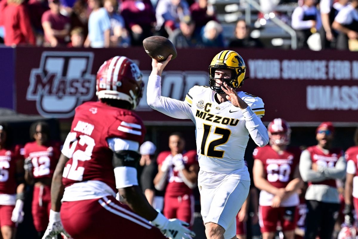 Oct 12, 2024; Amherst, Massachusetts, USA; Missouri Tigers quarterback Brady Cook (12)  throws a pass during the second half against the Massachusetts Minutemen at Warren McGuirk Alumni Stadium. Mandatory Credit: Eric Canha-Imagn Images
