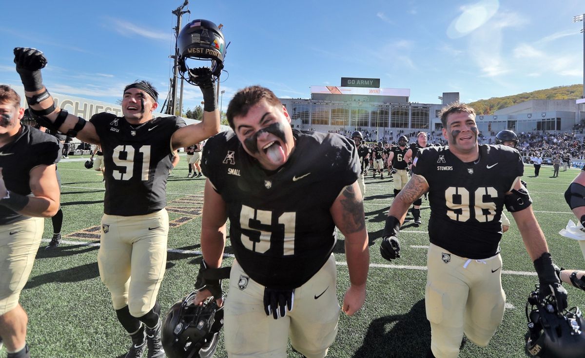 Oct 12, 2024; West Point, New York, USA; Army Black Knights offensive lineman Brady Small (51) and his teammates celebrate after a 44-10 win against the UAB Blazers at Michie Stadium. Army improved to 6-0 and became bowl eligible with the victory. Mandatory Credit: Danny Wild-Imagn Images