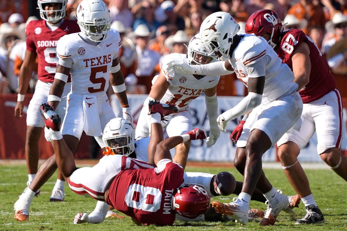 Oklahoma Sooners running back Taylor Tatum (8) fumbles the ball during the Red River Rivalry college football game between the University of Oklahoma Sooners (OU) and the Texas Longhorns at the Cotton Bowl in Dallas, Saturday, Oct. 12, 2024.