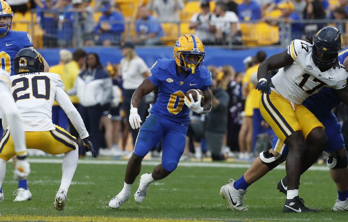 Oct 12, 2024; Pittsburgh, Pennsylvania, USA;  Pittsburgh Panthers running back Desmond Reid (0) runs the ball against the California Golden Bears during the third quarter at Acrisure Stadium. Pittsburgh won 17-15. Mandatory Credit: Charles LeClaire-Imagn Images