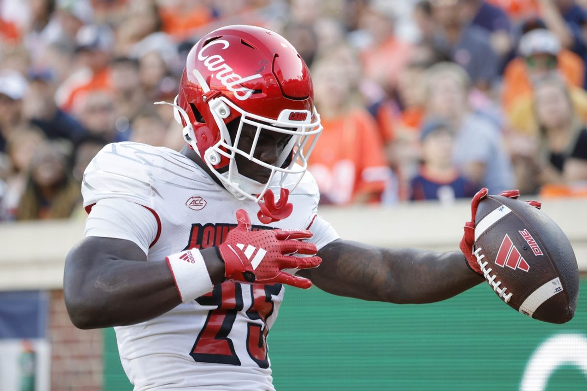Oct 12, 2024; Charlottesville, Virginia, USA; Louisville Cardinals running back Isaac Brown (25) celebrates after scoring a touchdown against the Virginia Cavaliers during the second half at Scott Stadium. Mandatory Credit: Amber Searls-Imagn Images