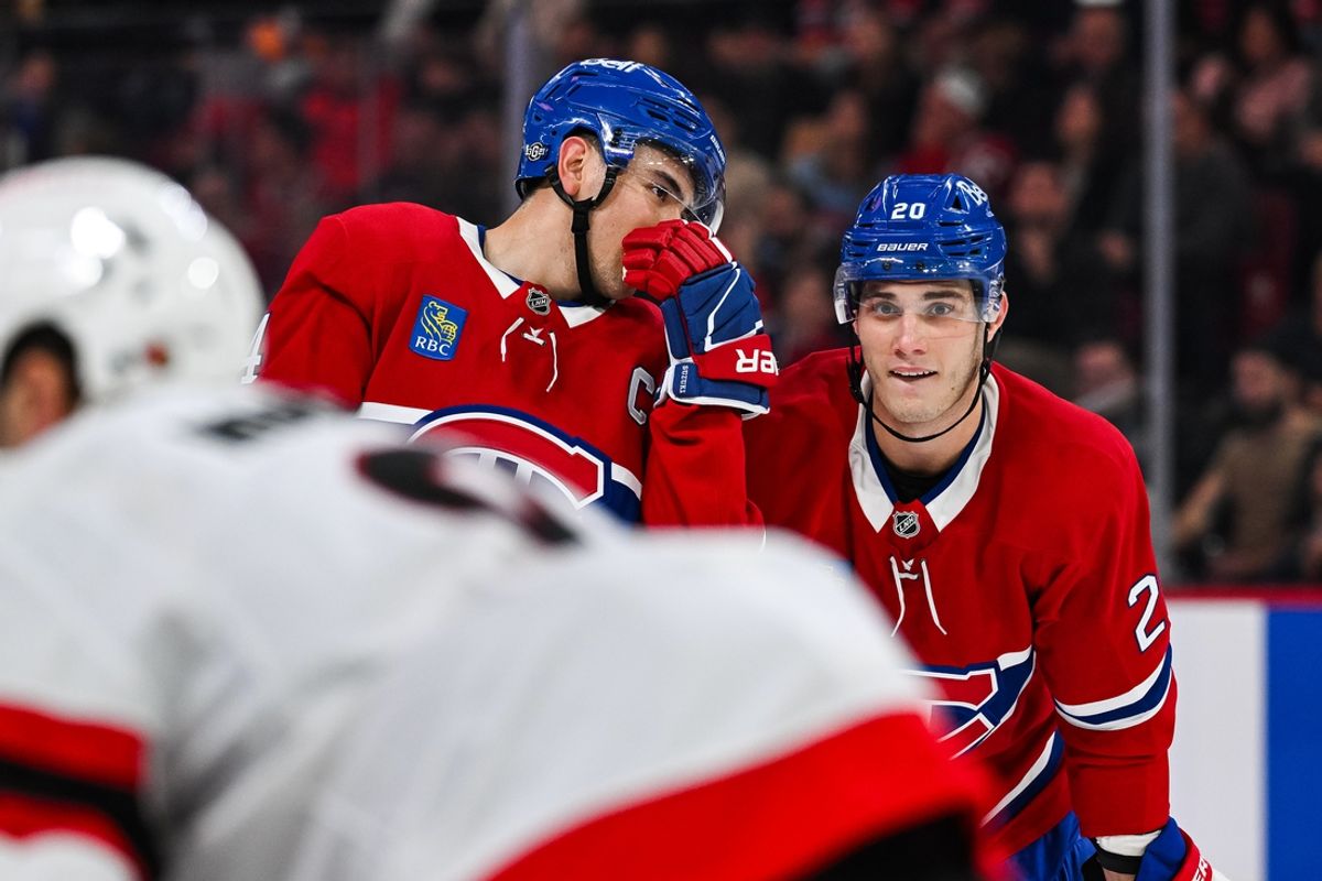 Oct 12, 2024; Montreal, Quebec, CAN; Montreal Canadiens center Nick Suzuki (14) discusses with left wing Juraj Slafkovsky (20) prior to a face-off against the Ottawa Senators during the first period at Bell Centre. Mandatory Credit: David Kirouac-Imagn Images