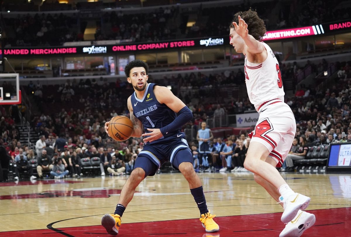 Oct 12, 2024; Chicago, Illinois, USA; Chicago Bulls guard Josh Giddey (3) defends Memphis Grizzlies guard Scotty Pippen Jr. (1) during the first half at United Center. Mandatory Credit: David Banks-Imagn Images