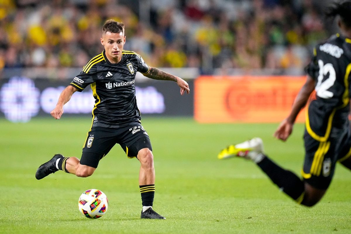 Oct 12, 2024; Columbus, Ohio, USA; Columbus Crew midfielder Alexandru Matan (20) dribbles the ball against the New England Revolution in the first half at Lower.com Field on Saturday.
