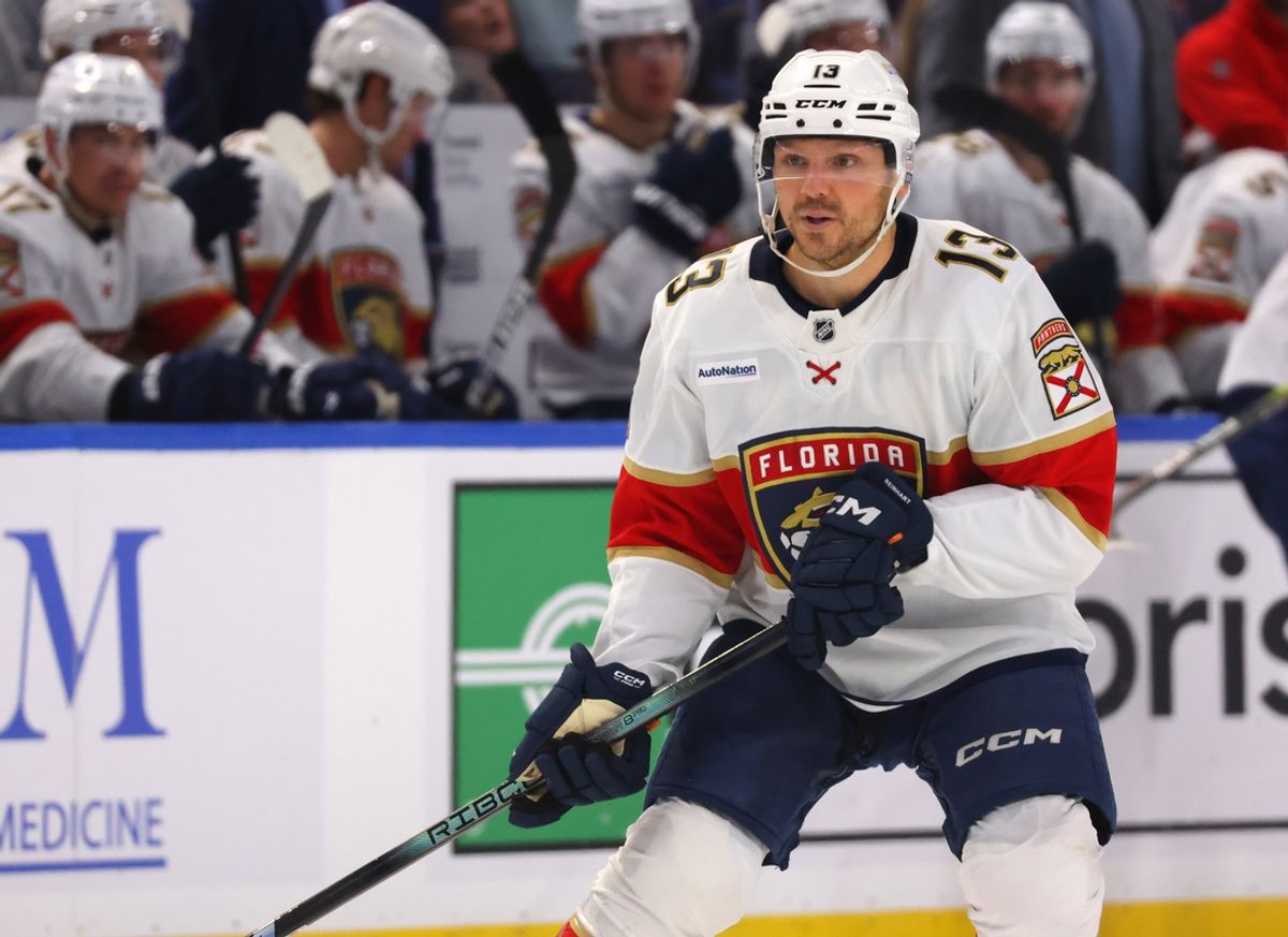 Oct 12, 2024; Buffalo, New York, USA;  Florida Panthers center Sam Reinhart (13) looks for the puck during the third period against the Buffalo Sabres at KeyBank Center. Mandatory Credit: Timothy T. Ludwig-Imagn Images