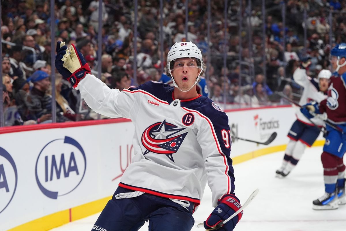 Oct 12, 2024; Denver, Colorado, USA; Columbus Blue Jackets center Kent Johnson (91) celebrates his goal scored in the first period against the Colorado Avalanche at Ball Arena. Mandatory Credit: Ron Chenoy-Imagn Images