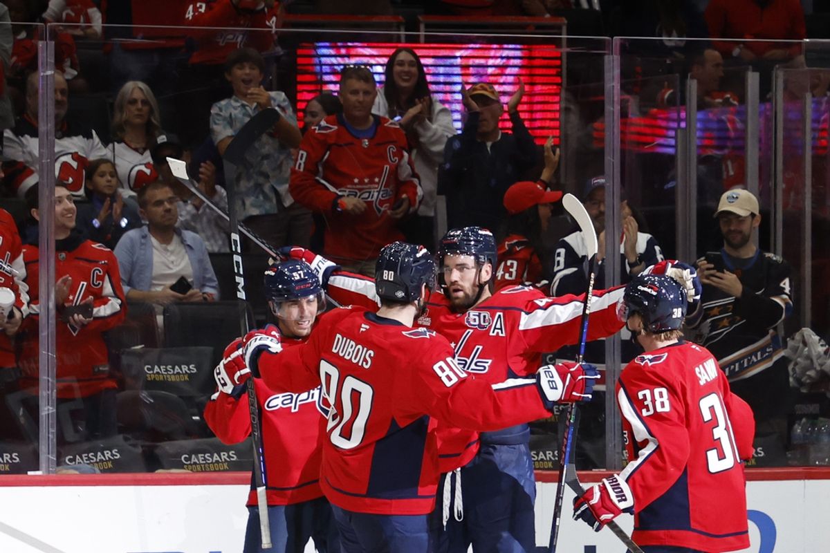 Oct 12, 2024; Washington, District of Columbia, USA; Washington Capitals right wing Tom Wilson (43) celebrates with teammates after scoring a goal against the New Jersey Devils in the third period at Capital One Arena. Mandatory Credit: Geoff Burke-Imagn Images