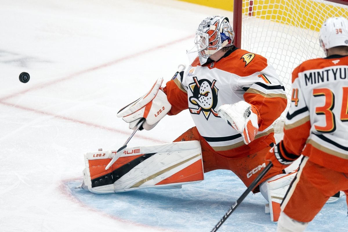 Oct 12, 2024; San Jose, California, USA;  Anaheim Ducks goaltender Lukas Dostal (1) deflects a shot on goal by the San Jose Sharks during the first period at SAP Center at San Jose. Mandatory Credit: D. Ross Cameron-Imagn Images
