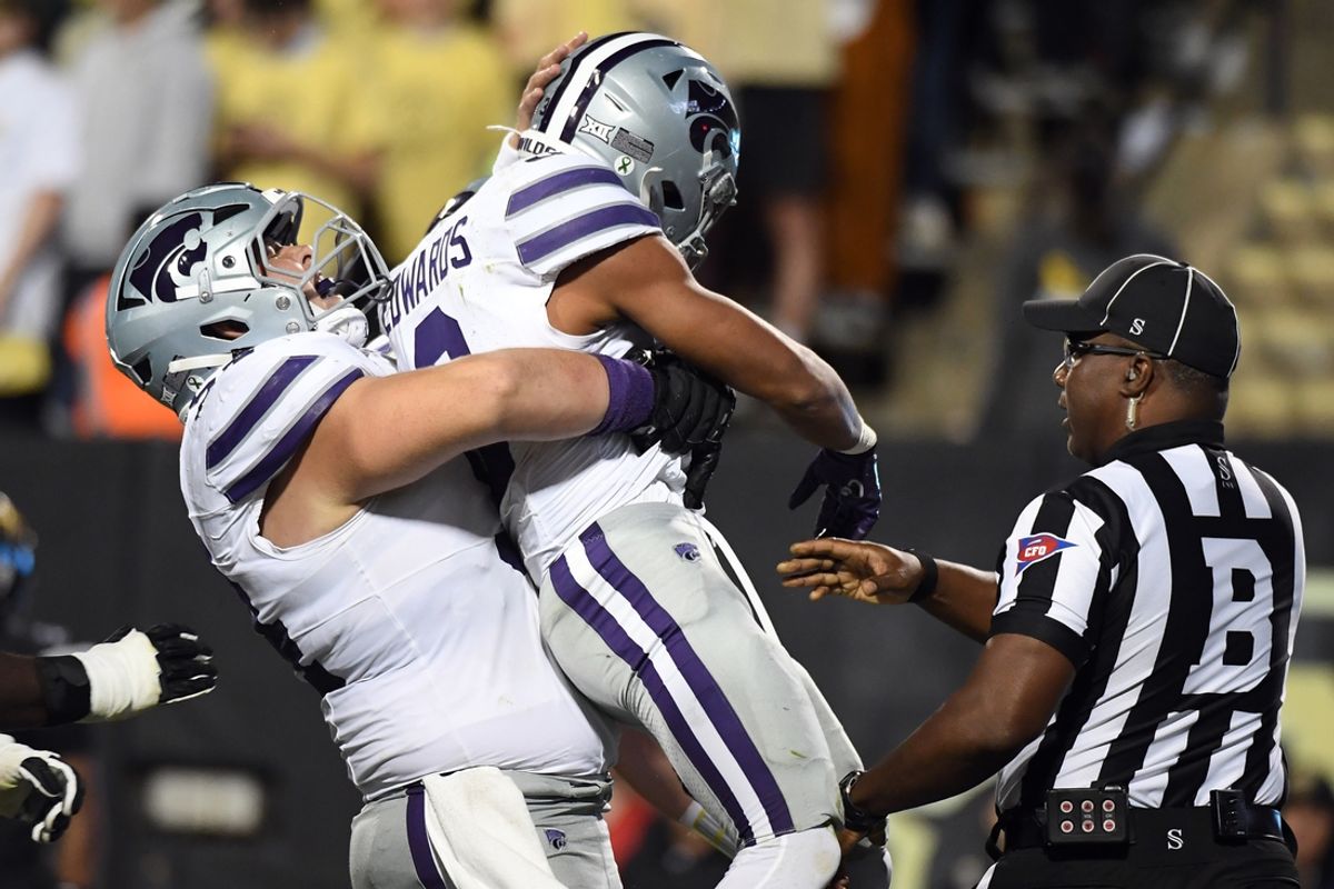 Oct 12, 2024; Boulder, Colorado, USA; Kansas State Wildcats running back Dylan Edwards (3) celebrates with offensive lineman Hadley Panzer (54) after a touchdown during the first half against the Colorado Buffaloes at Folsom Field. Mandatory Credit: Christopher Hanewinckel-Imagn Images