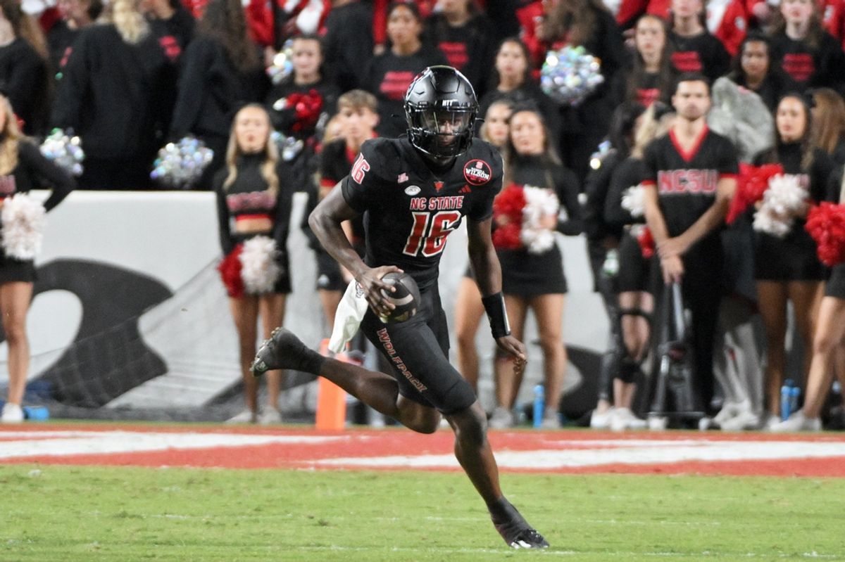 Oct 12, 2024; Raleigh, North Carolina, USA;  North Carolina State Wolfpack quarter back CJ Bailey (16) looks for an opening during the second half at Carter-Finley Stadium. Mandatory Credit: Zachary Taft-Imagn Images