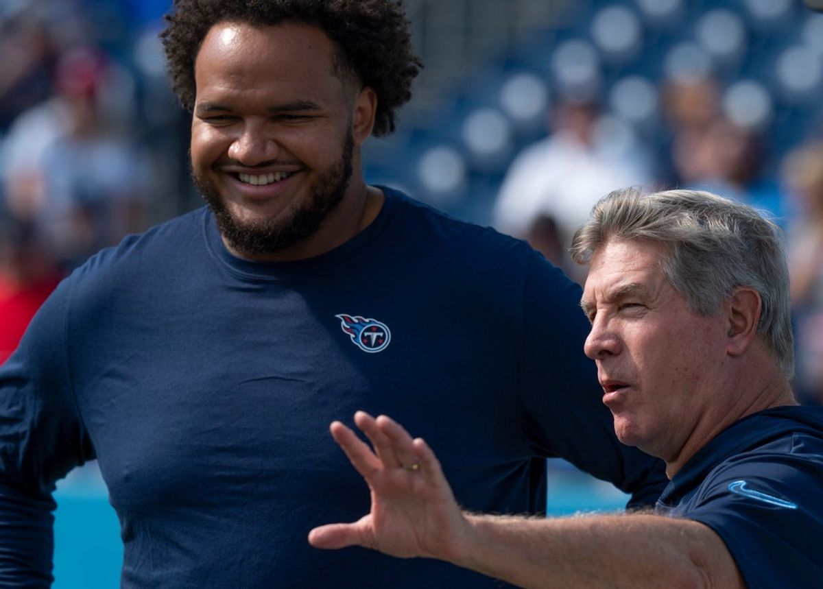 Tennessee Titans offensive tackle John Ojukwu (61) talks with Offensive Line Coach Bill Callahan before their game against the Indianapolis Colts at Nissan Stadium in Nashville, Tenn., Sunday, Oct. 13, 2024.